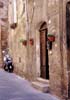 travel photo of doorway, scooter in Pitigliano, Tuscany Italy by Diane Rose Photographs